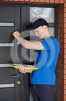 Delivery guy knocking on door photo