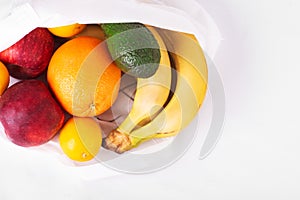 Delivery healthy food background. Vegan vegetarian food in fabric bag fruits on white, copy space, banner