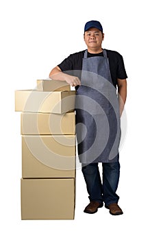 Delivery man in Black shirt and apron with stack of boxes isolated