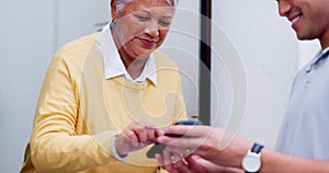 Delivery man, box and old woman with payment for online shopping purchase at front door of home. Package, senior person