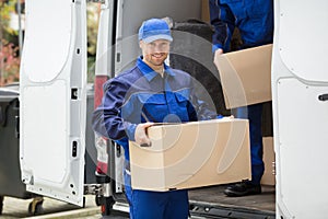 Delivery Man Carrying Cardboard Box