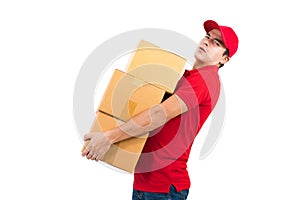Delivery man carrying heavy boxes