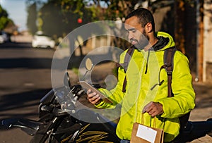 Delivery man checking spreadsheet of deliveries to be made photo