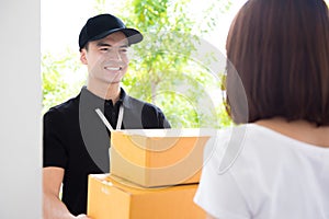 Delivery man deliver packages to a woman