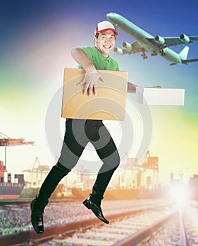 Delivery man delivering carton box against logistic business background