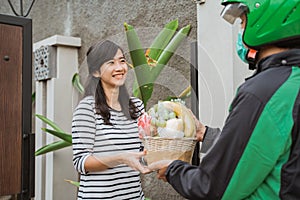 Delivery man delivering fruit parcel