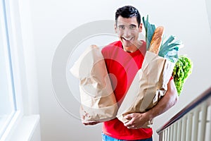 Delivery man delivering groceries