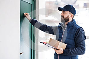 Delivery man delivering parcel box to recipient.