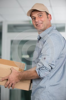 Delivery man delivering parcel box to recipient