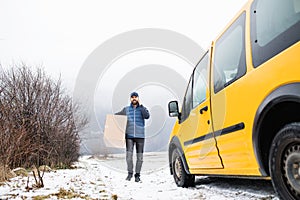 Delivery man delivering parcel box to recipient.