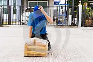 Delivery man he emotional courier hold damaged cardboard box is broken