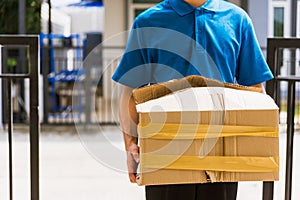 Delivery man he emotional courier hold damaged cardboard box is broken