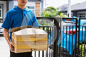 Delivery man he emotional courier hold damaged cardboard box is broken