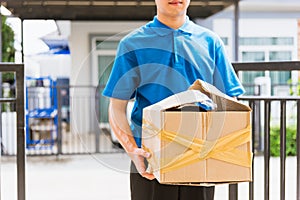 Delivery man he emotional courier hold damaged cardboard box is broken