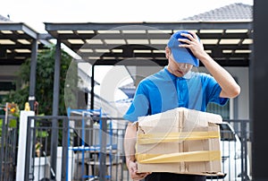 Delivery man Frightened with cardboard box damaged broken accident before delivering to customers