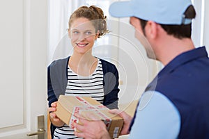 Delivery man handing over a parcel to customer