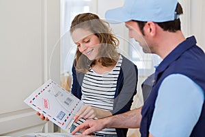 Delivery man handing over a registered mail