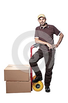 Delivery man with handtruck and parcel photo