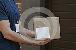 Delivery man hold blank box outdoor