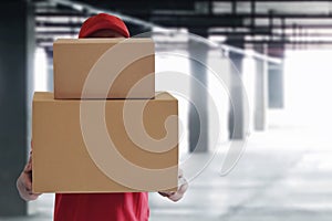 Delivery man hold cardboard box
