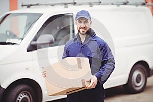 Delivery man holding box