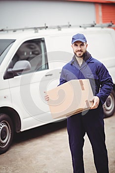 Delivery man holding box