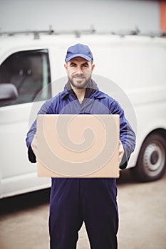 Delivery man holding box