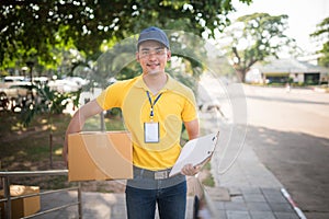 Delivery man holding cardboard boxes