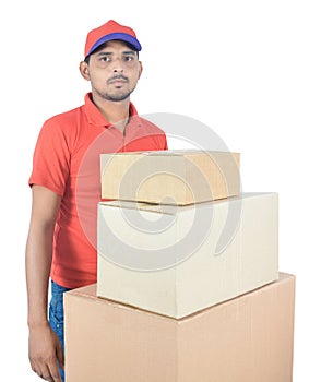 Delivery man holding carton boxes in uniform