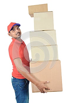 Delivery man holding carton boxes in uniform