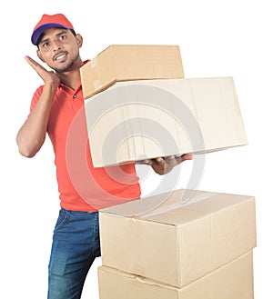 Delivery man holding carton boxes in uniform