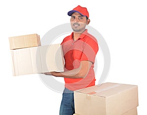 Delivery man holding carton boxes in uniform