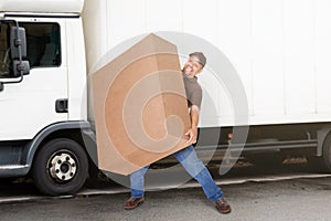 Delivery Man Holding Heavy Box