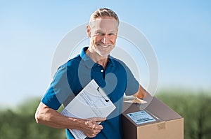 Delivery man holding parcel