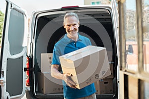 Delivery man holding parcel