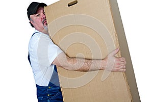 Delivery man lifting heavy cardboard box