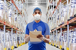 Delivery man in mask or respirator at warehouse