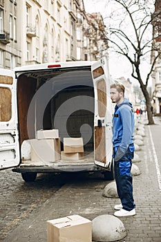 Delivery man with package outdoors