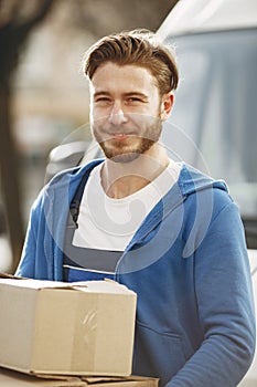 Delivery man with package outdoors