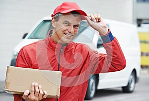 Delivery man with package outdoors