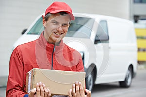 Delivery man with package outdoors