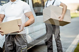 Delivery man with parcel outdoors