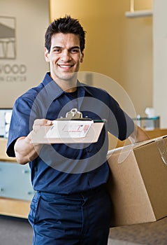 Delivery man presenting shipping receipt