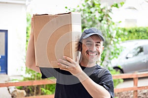 A delivery man with a prominent mustache and a blue hat delivering a generic brown box at a house