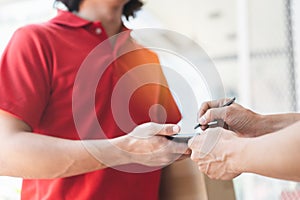 Delivery Man sending package to receiver on doorway