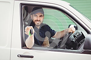 Delivery man sitting in his van