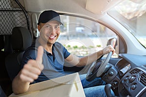 Delivery man sitting in a delivery van