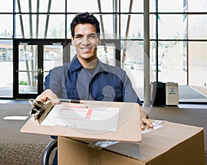 Delivery man in uniform with stack of boxes