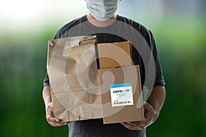Delivery  medical box of vaccines from courier man receive package from professional delivery Coronavirus, Covid 19 virus, vaccine