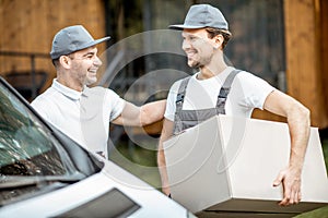 Delivery men portrait near the car